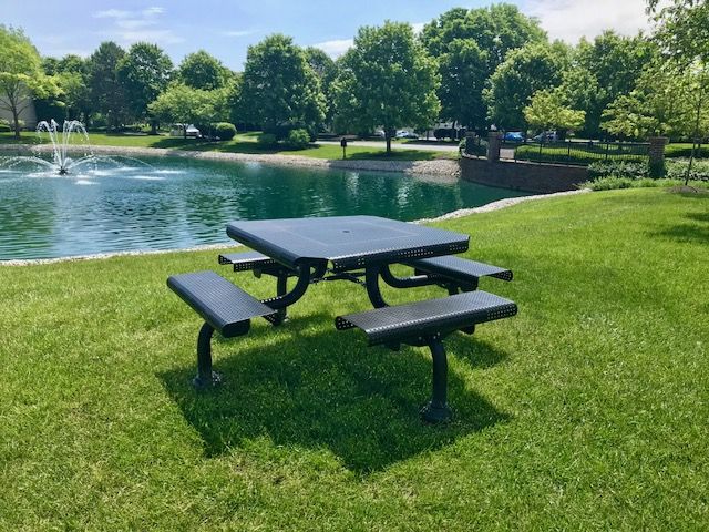Black park bench with four seats