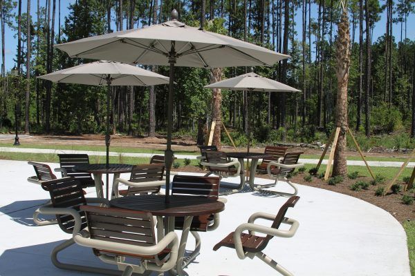 Dining sets with umbrellas on an outdoor patio
