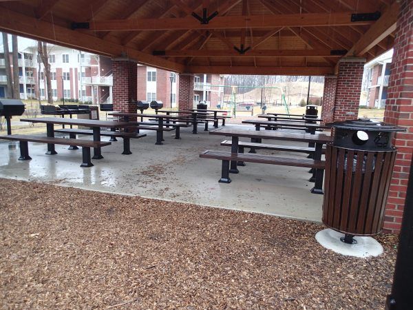 Rows of black picnic tables